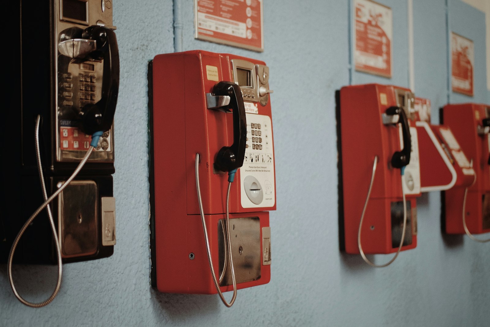 Samsung NX3000 sample photo. Four wall mounted telephones photography