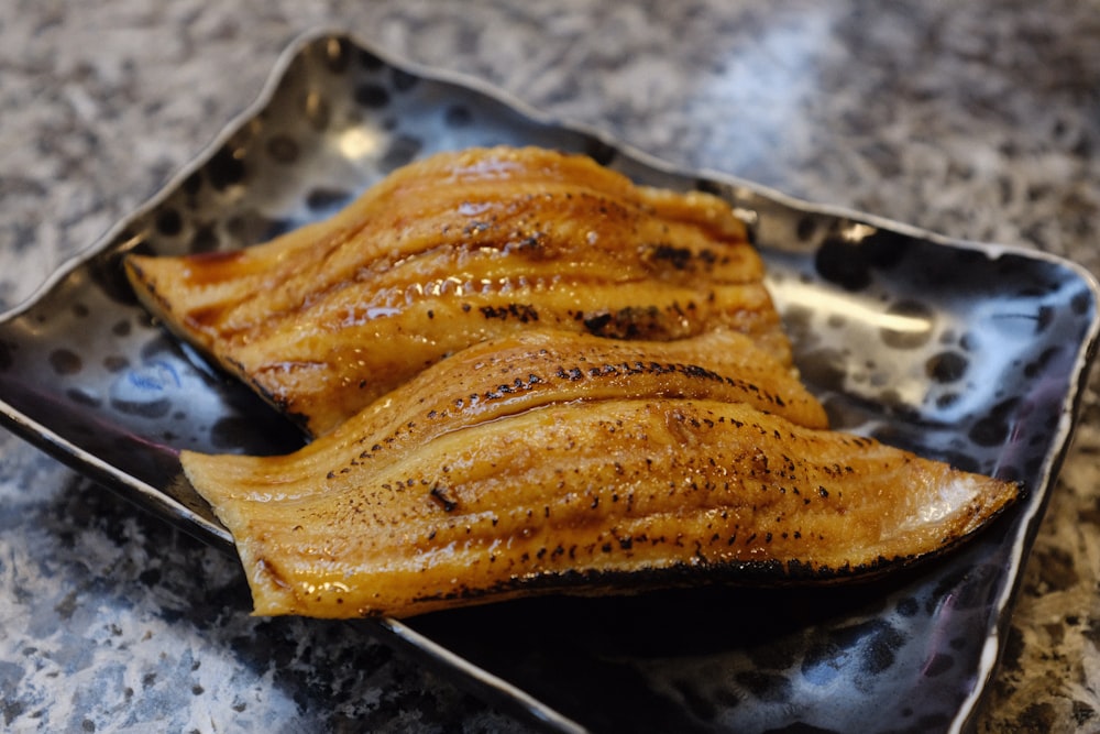 grilled viand on gray platter