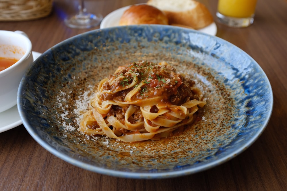 cooked pasta on blue plate