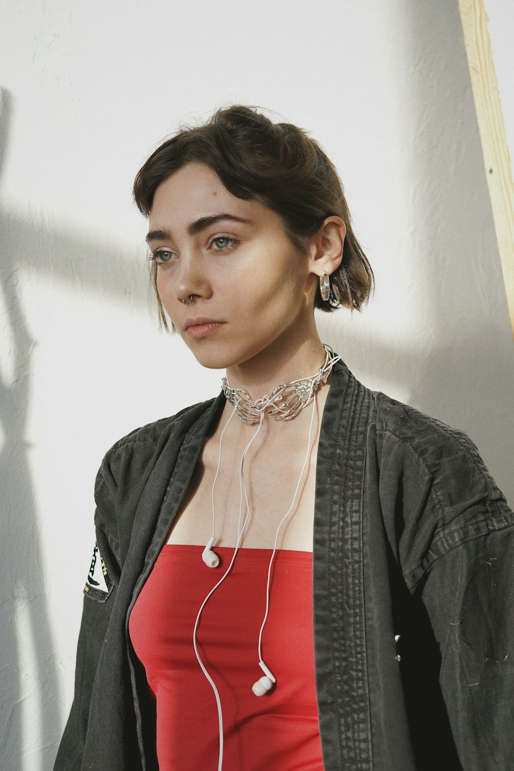 woman in black jacket and red dress