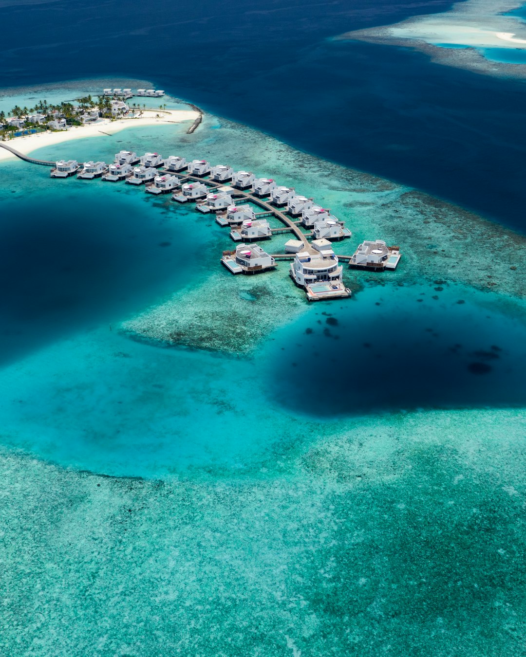 aerial photo of buildings surrounded by sea during daytime