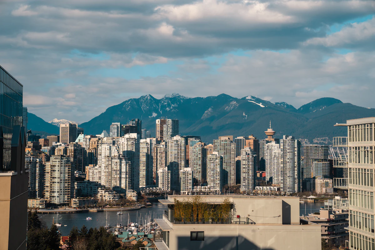 The Vancouver skyline against water and mountains