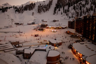 snow covered places and buildings during daytime