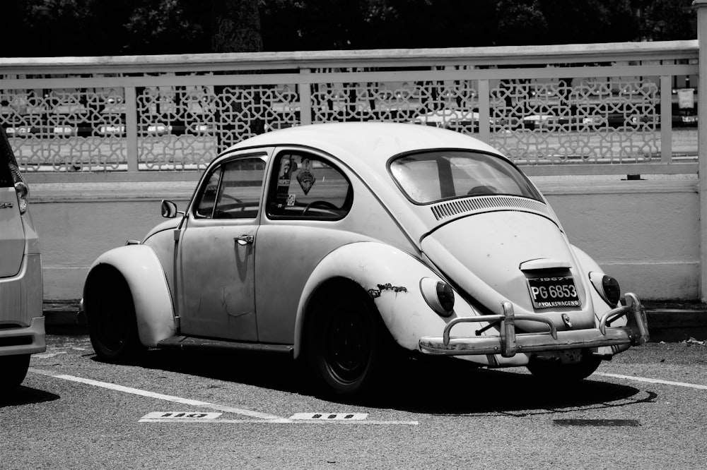 grey scale photography of Volkswagen New Beetle