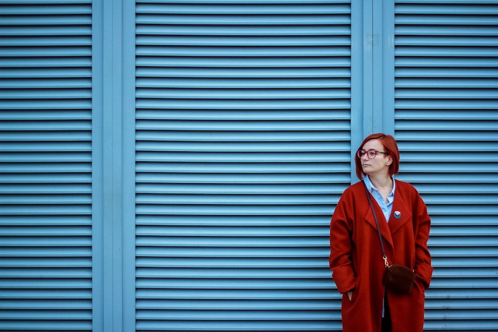 woman standing near wall shingles