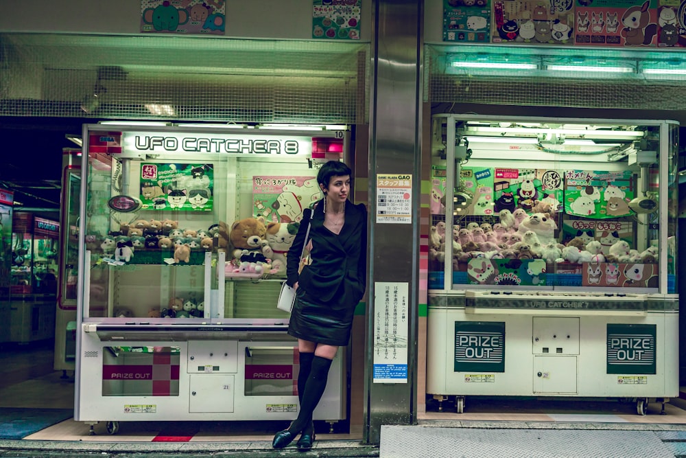 woman wearing black ruched mini dress