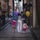 Happy family exploring a vibrant European city street, children holding balloons