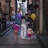 Happy family exploring a vibrant European city street, children holding balloons