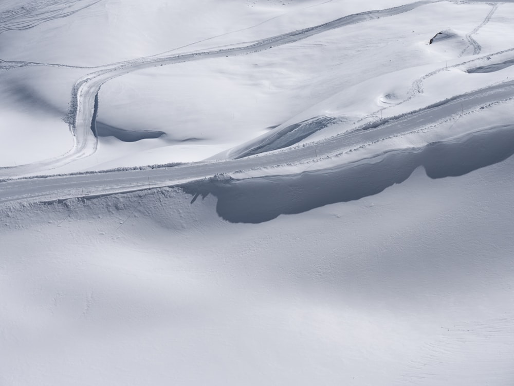 aerial photo of snow covered road during daytime