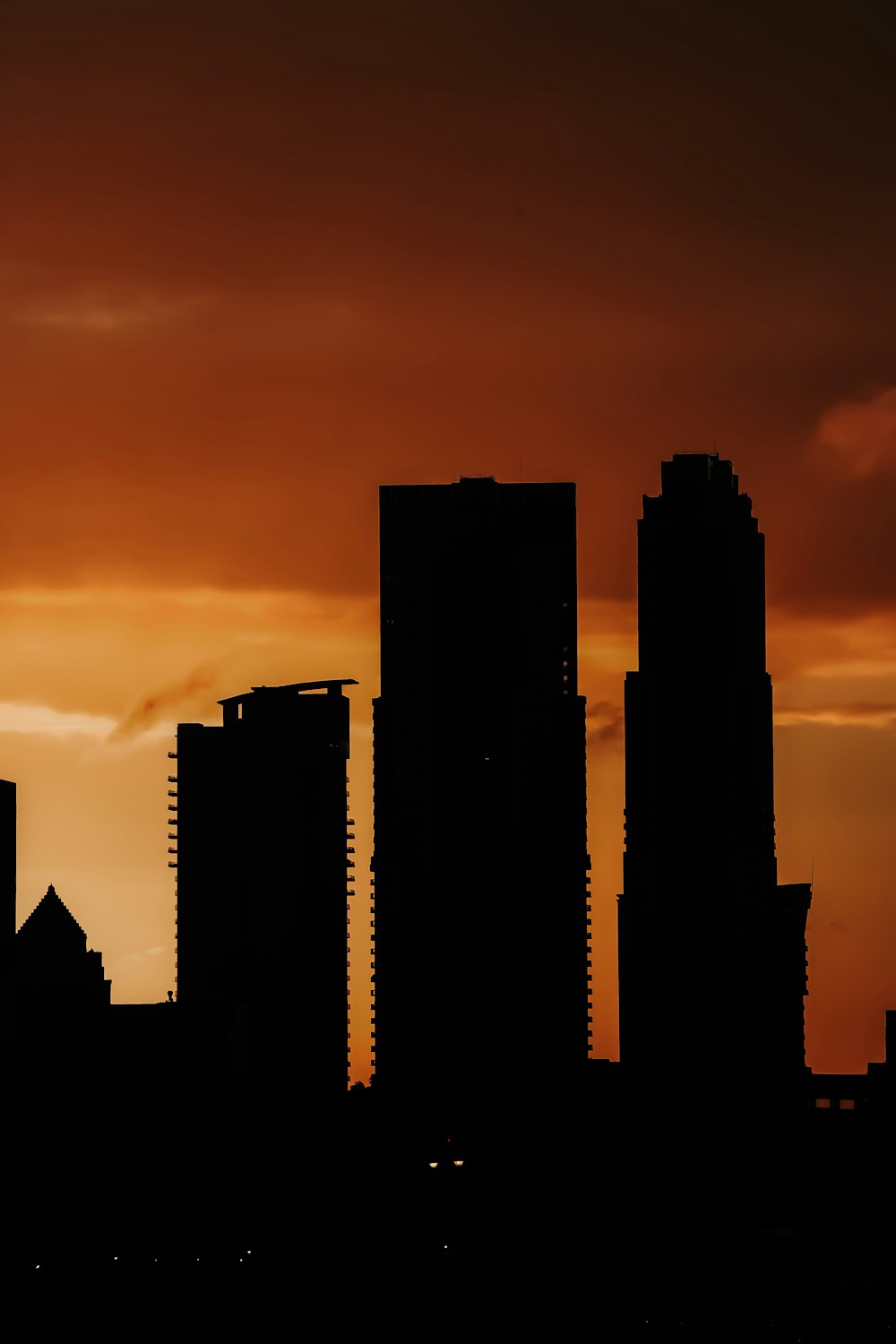 silhouette of three buildings