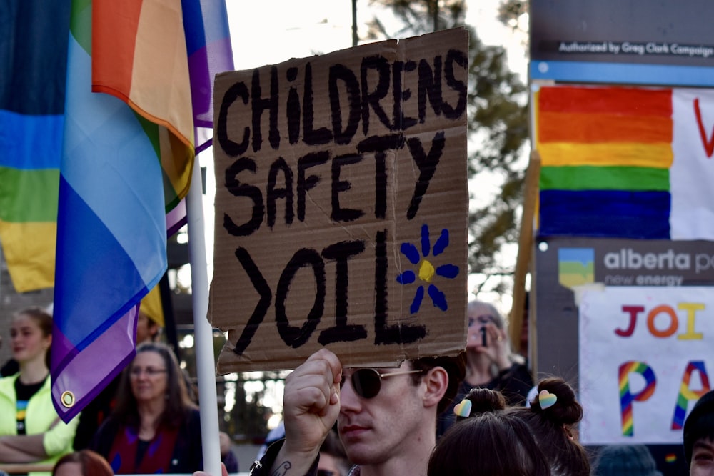 man carrying card with Children's Safety Oilo