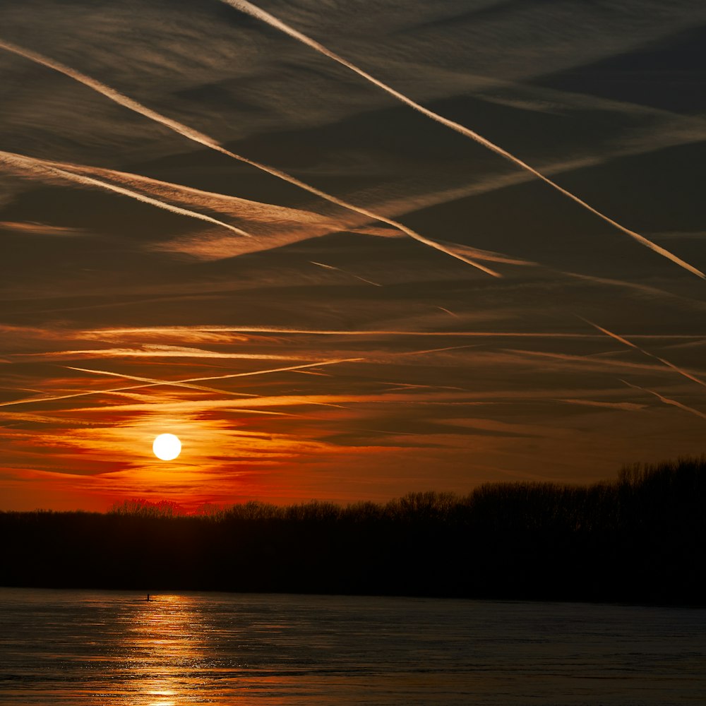 body of water during golden hour