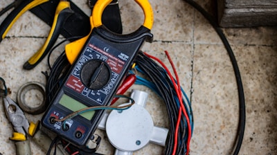 black and yellow clamp meter