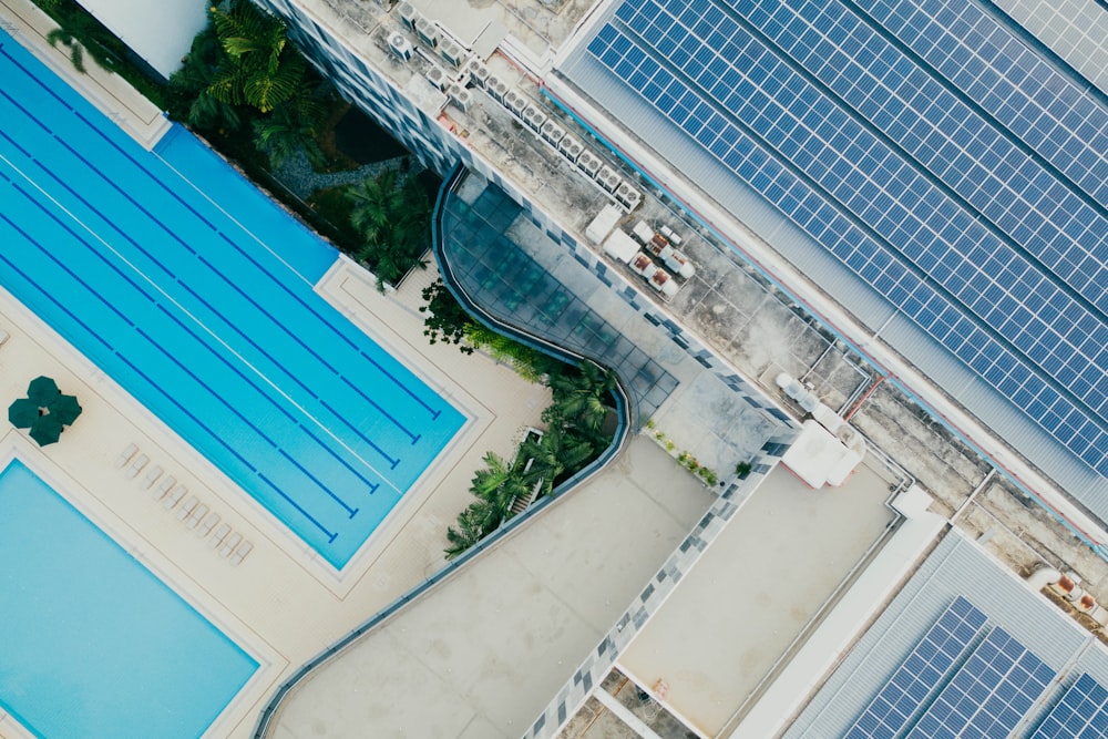 aerial photography of concrete building with swimming pool