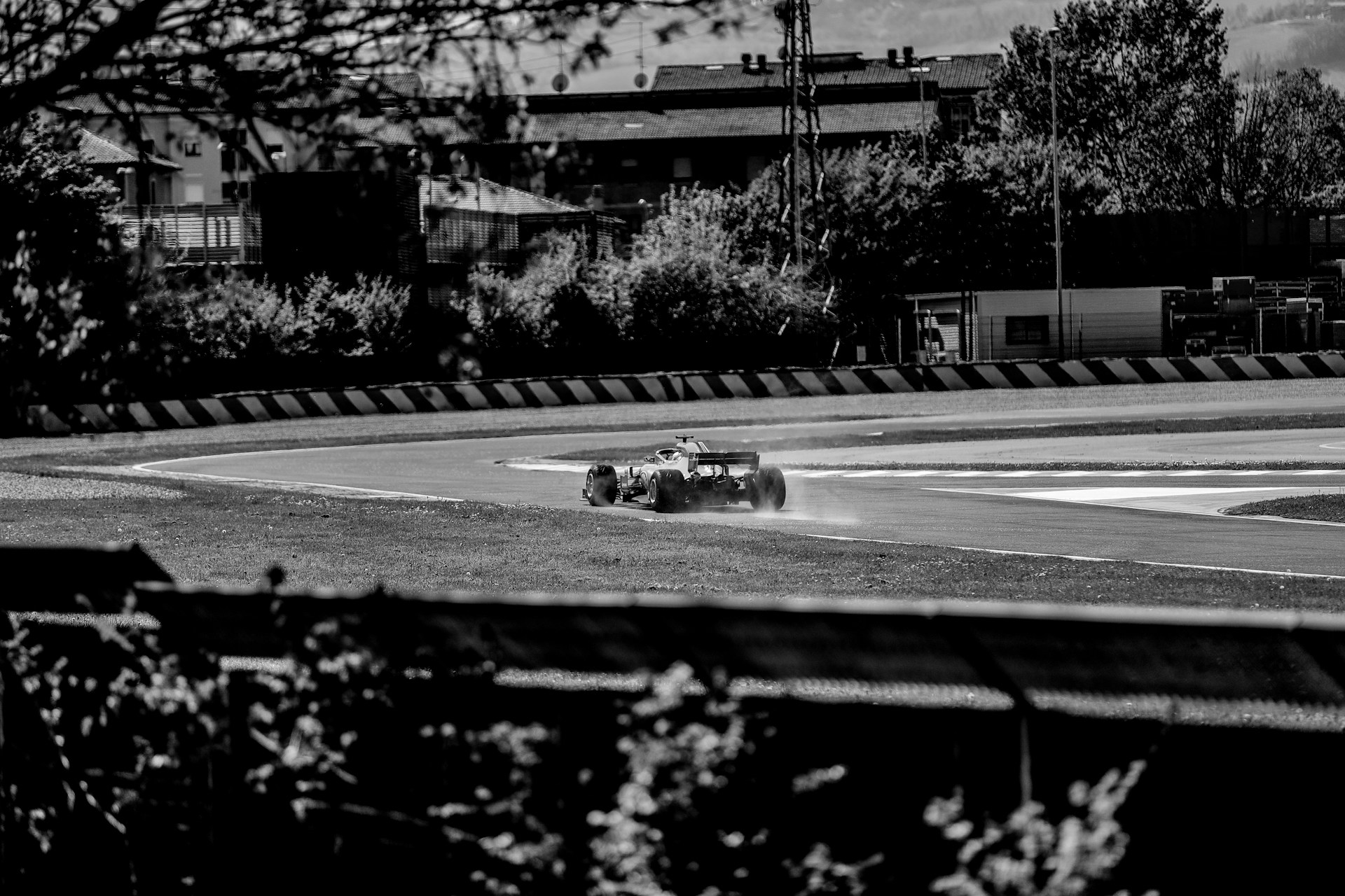 An iconic black and white photo of a classic Formula 1 car from the early days of the sport.