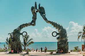 man and woman holding each other arch