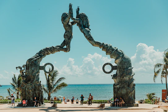 man and woman holding each other arch