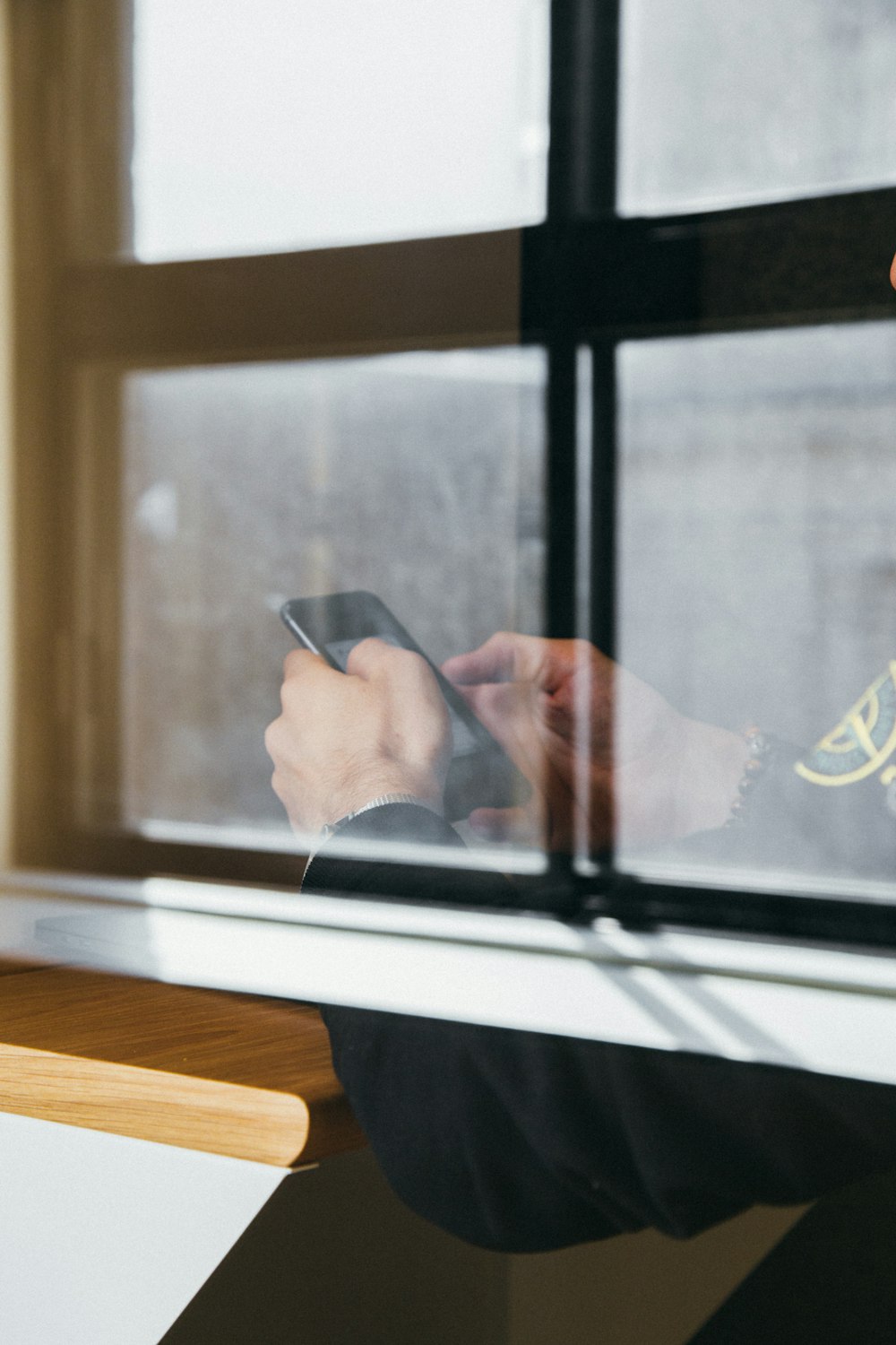 man holding black Android smartphone