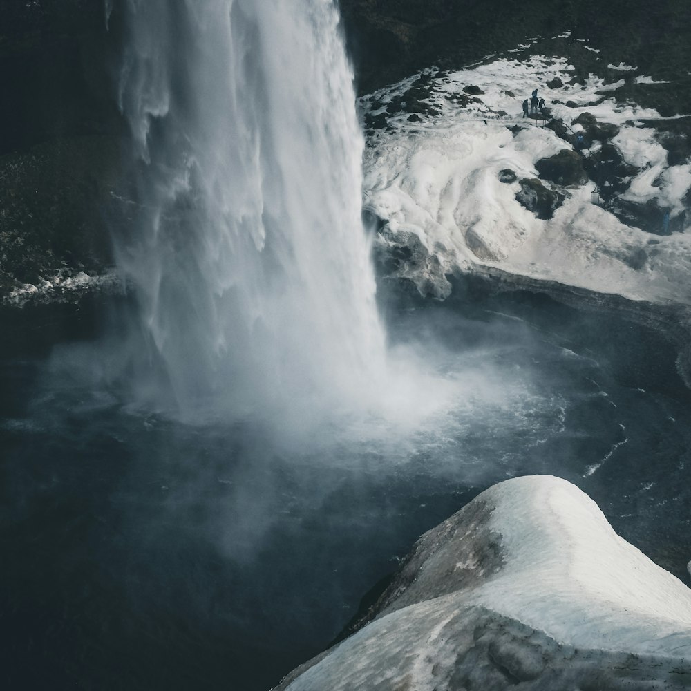 waterfalls surrounded by ice
