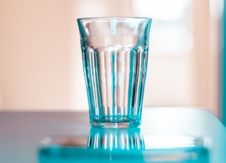 clear drinking glass on white table