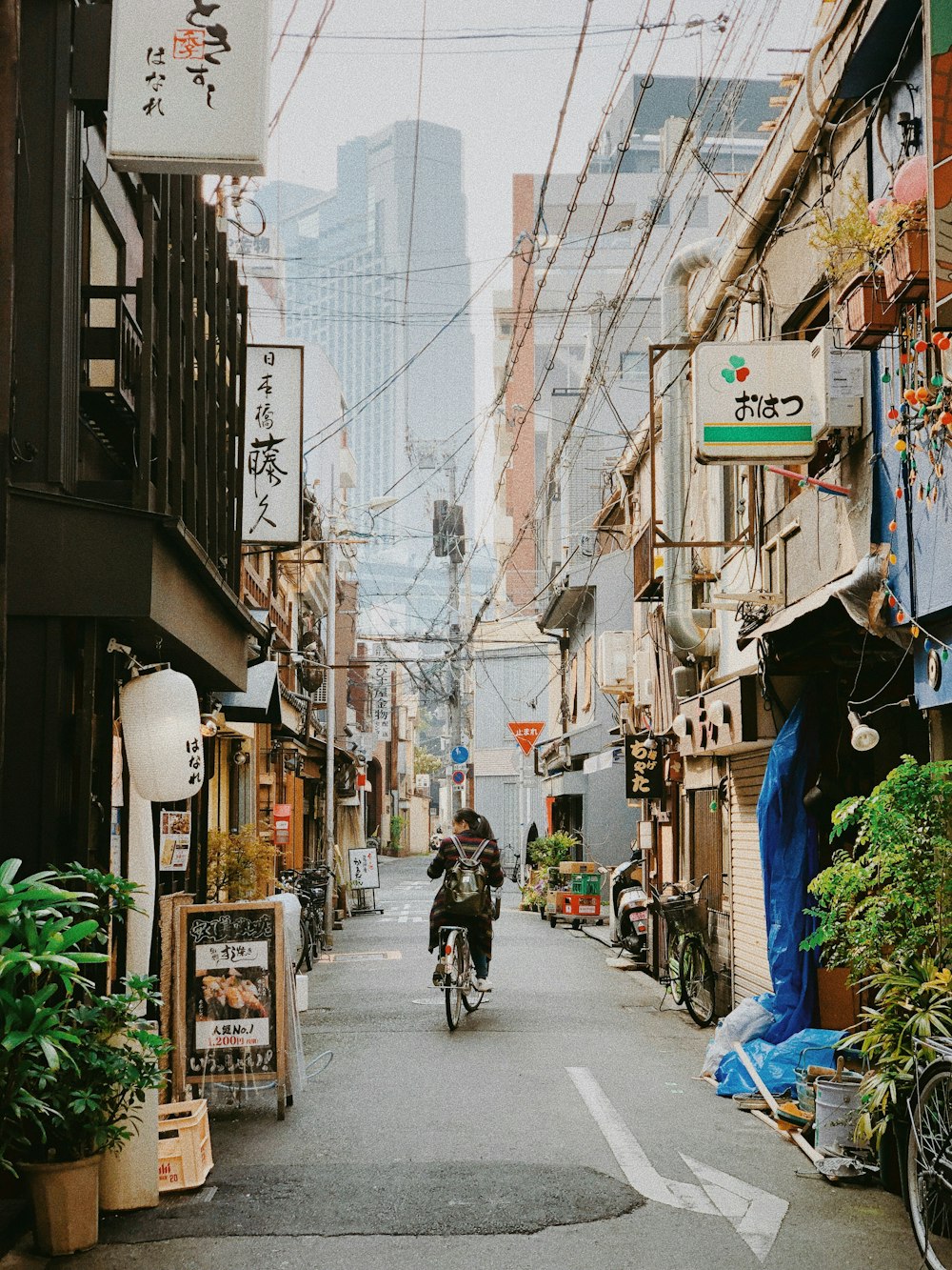 woman cycling in the middle of road