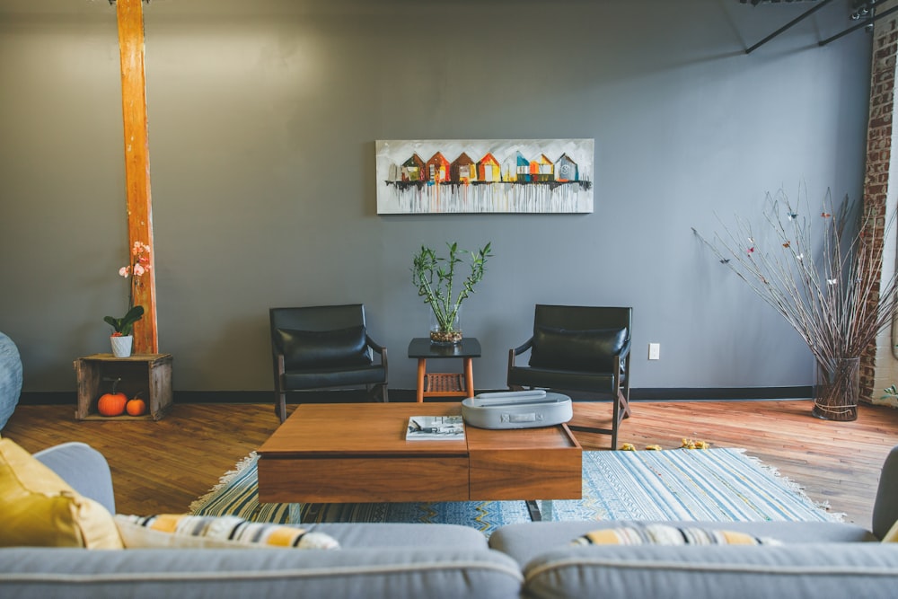 two black leather padded armchairs near coffee table