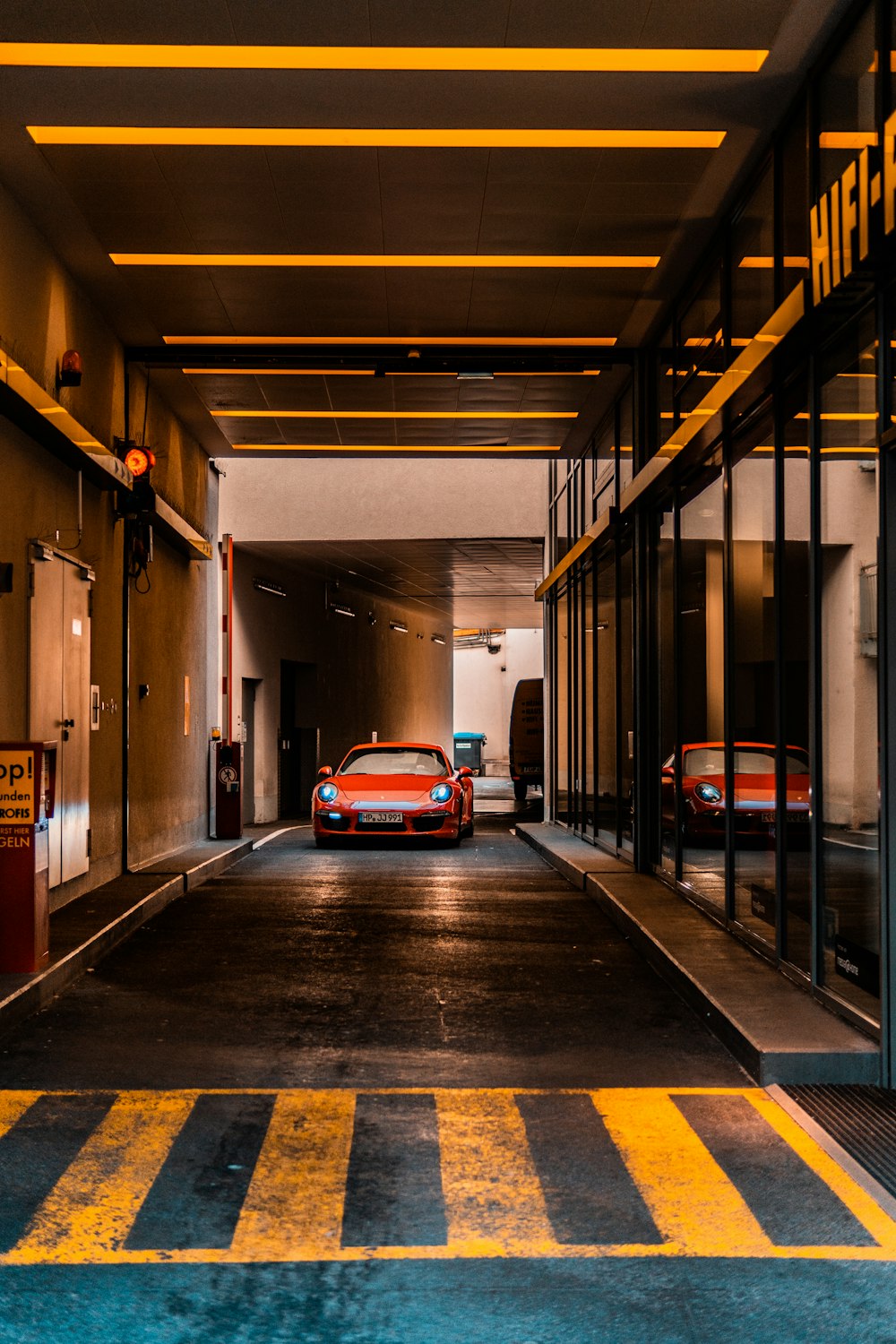 orange car inside building