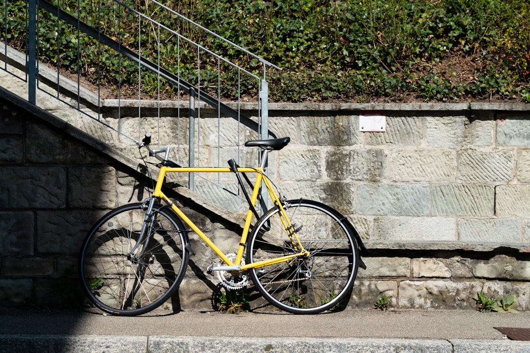 yellow mountain bike leaning on stair