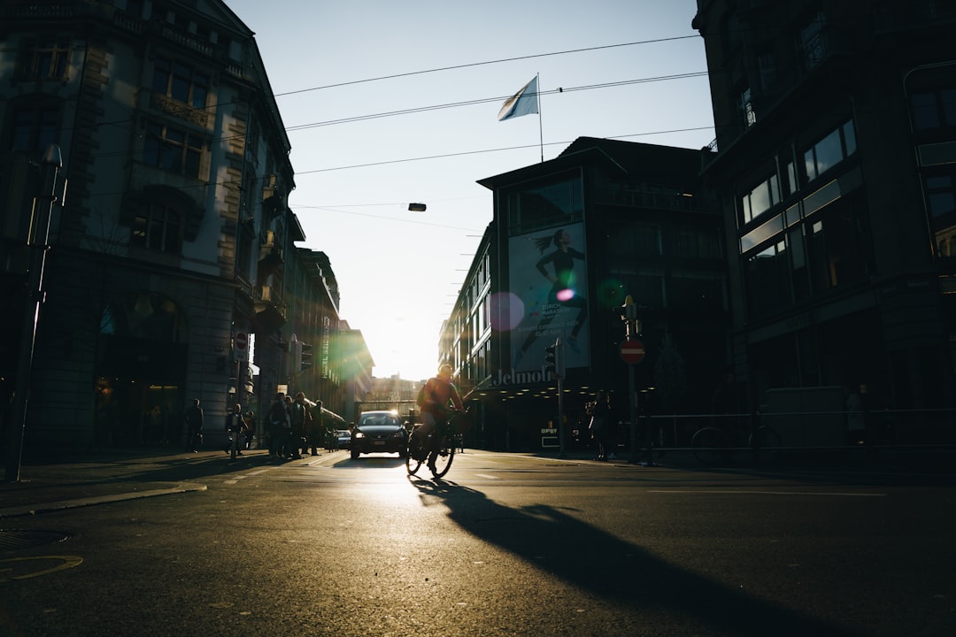 silhouette of person and vehicle during daytime