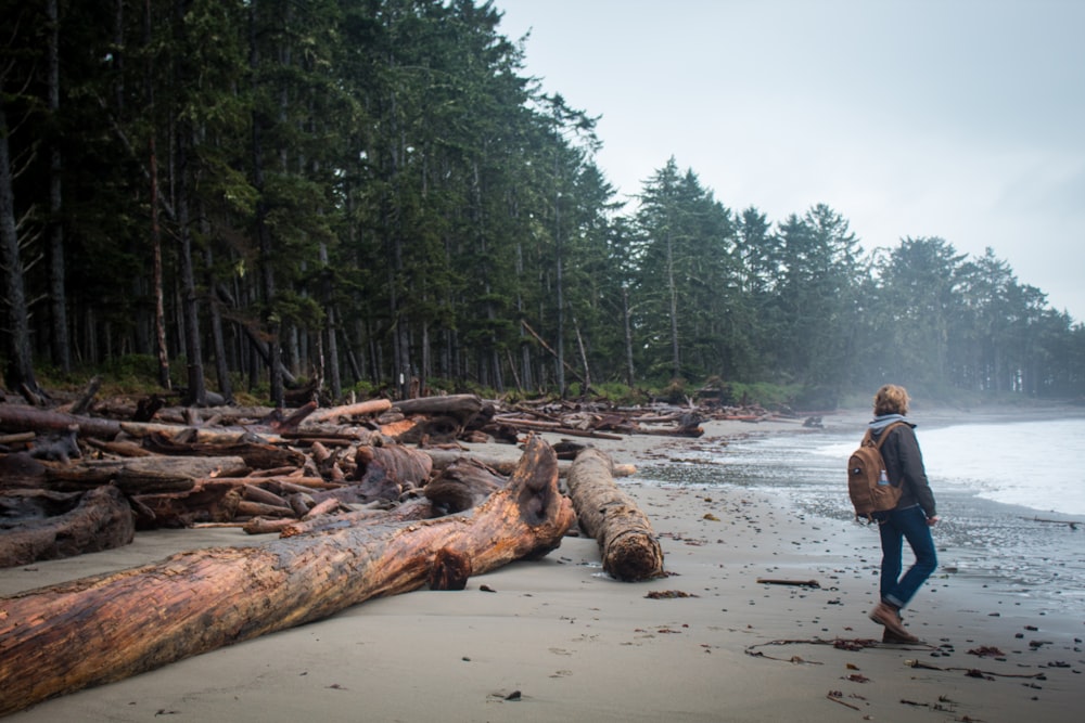 woman walking on shore