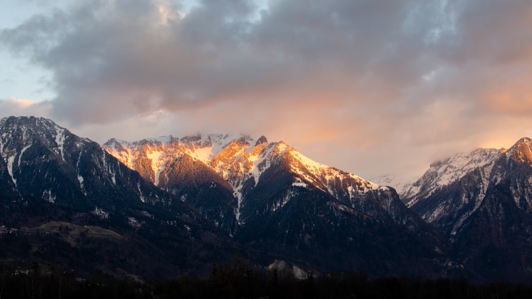 mountain under cloudy sky