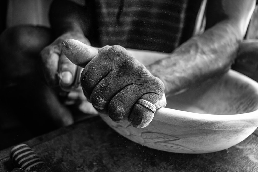 grayscale photo person wearing ring