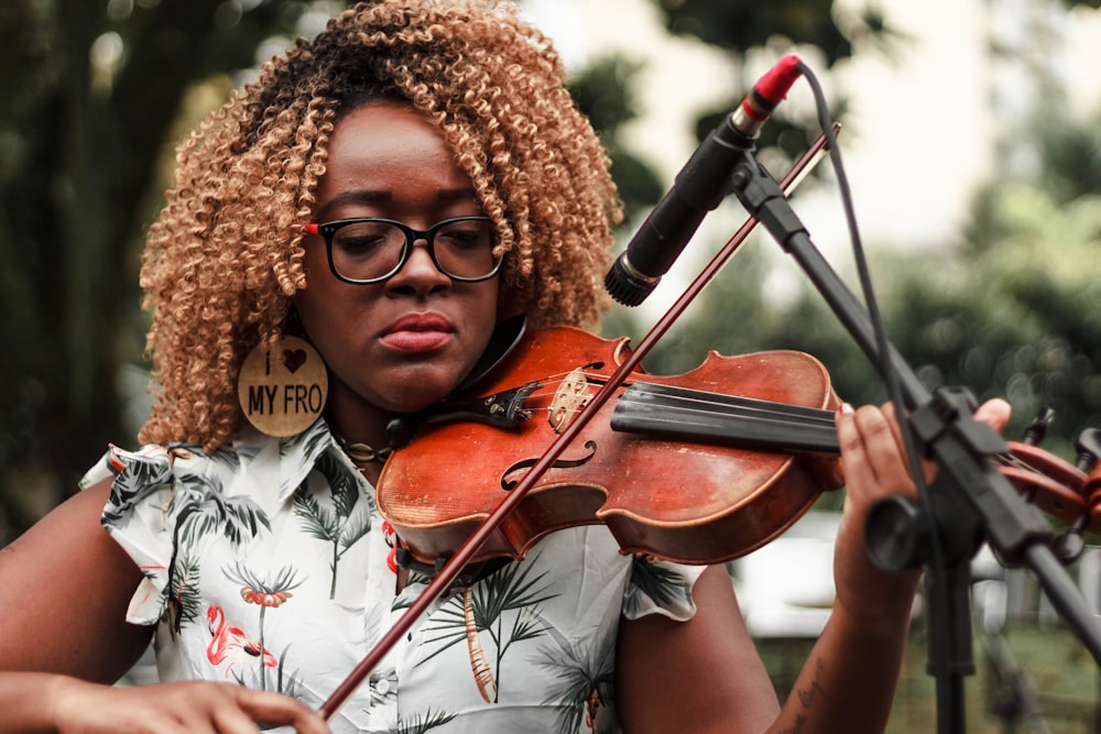 one unknown person playing violin