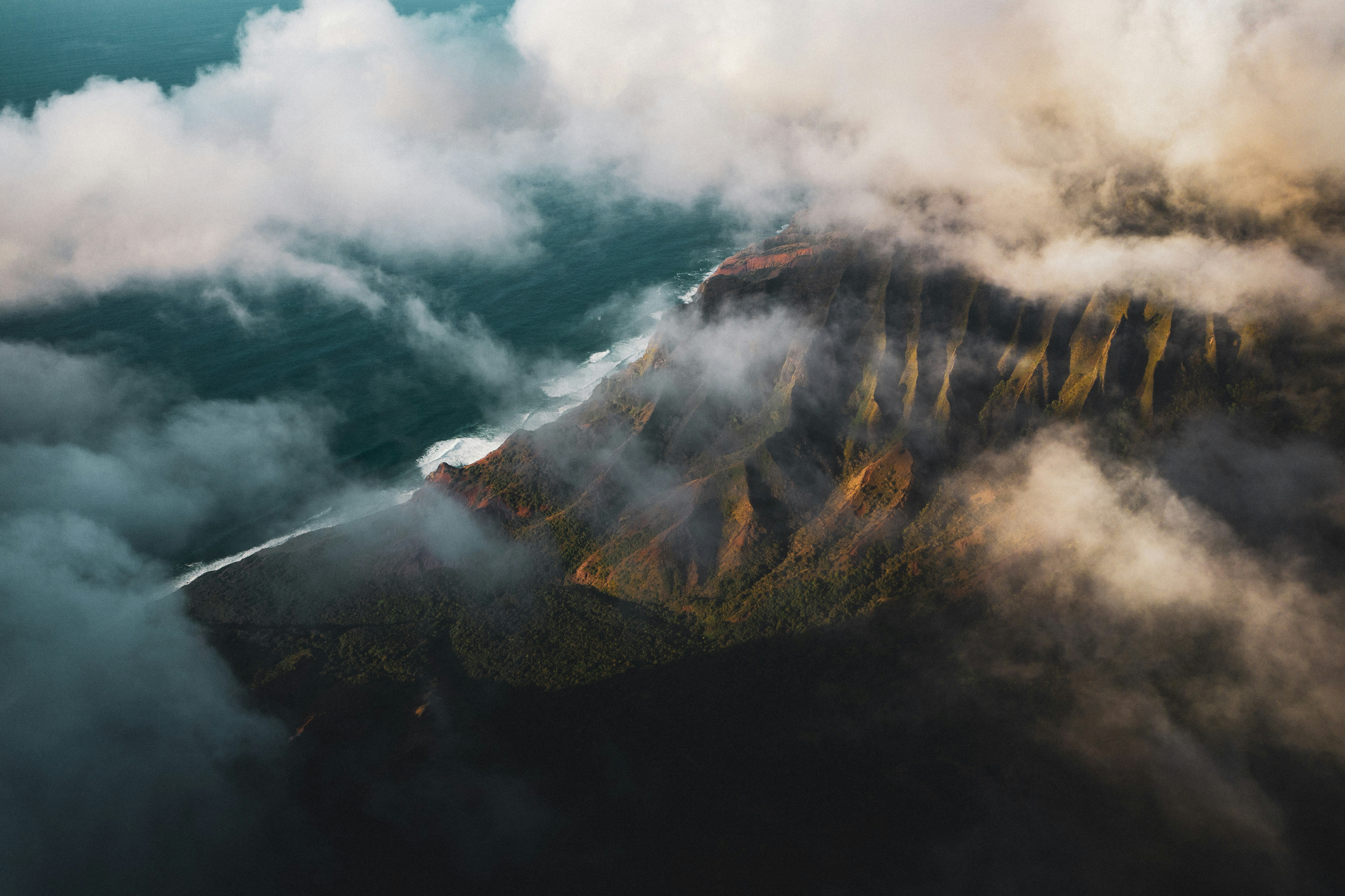 aerial photography of mountain covered with fog