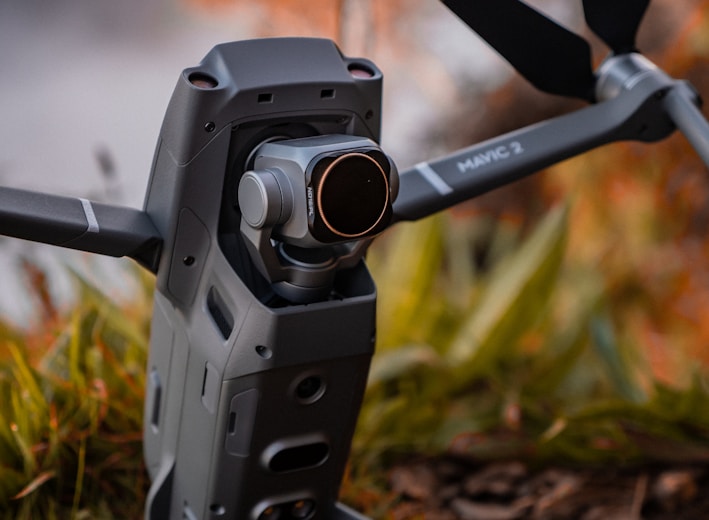 selective focus photography of black DJI Mavic 2 on ground