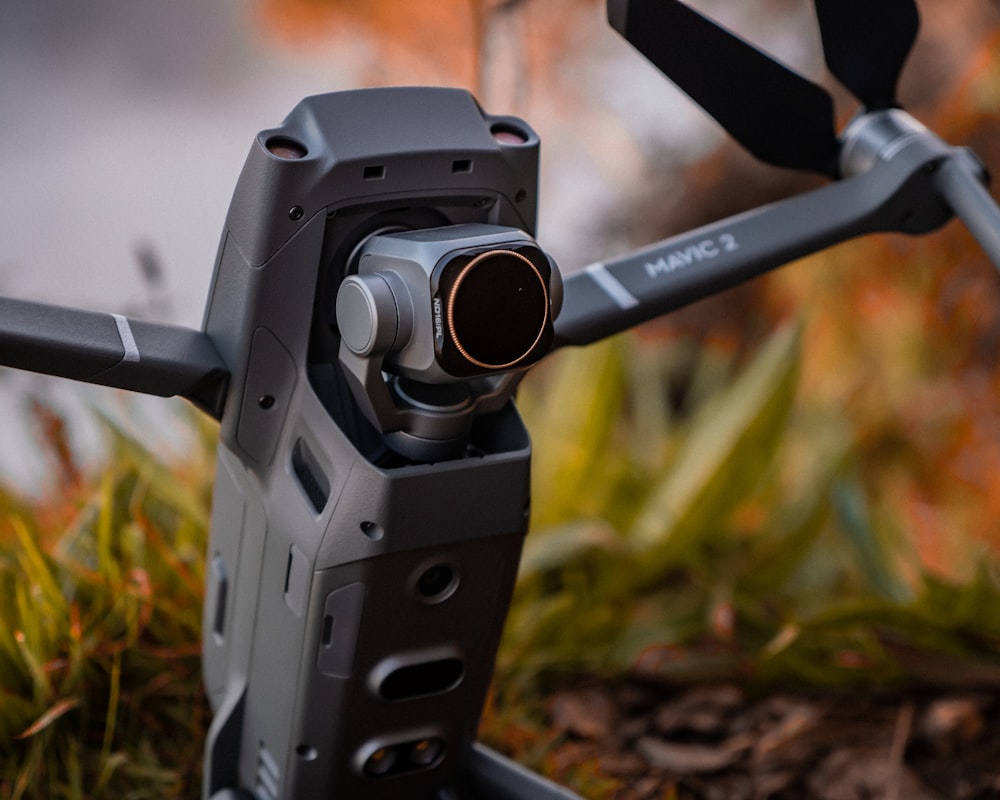 selective focus photography of black DJI Mavic 2 on ground