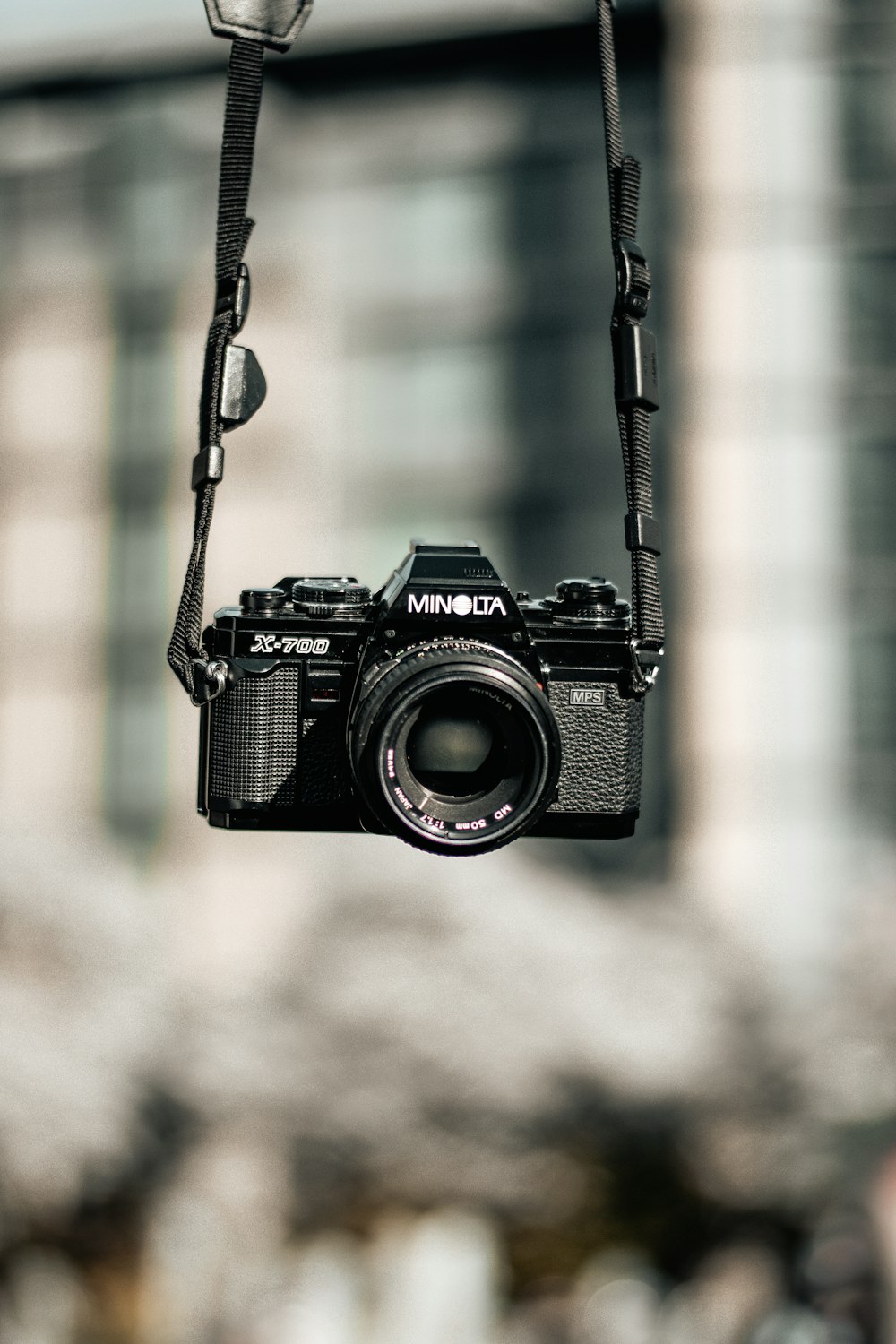 black Minolta DSLR camera selective focus photography