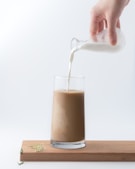 September 27, Chocolate Milk Day, Person pouring milk into chocolate milk