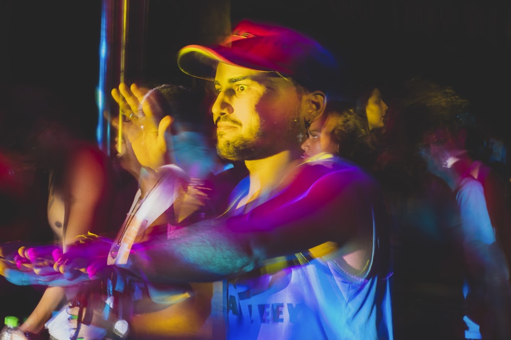 reflection of yellow and purple lights on man