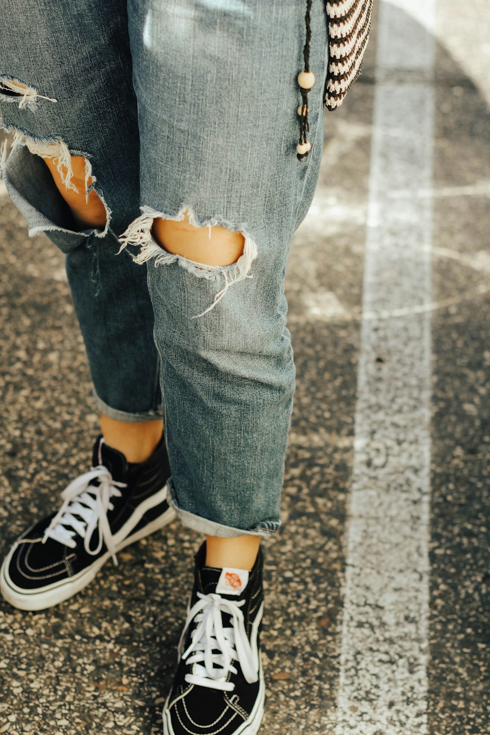 close-up photo of blue denim jeans and pair of black Vans sneakers photo –  Free Footwear Image on Unsplash