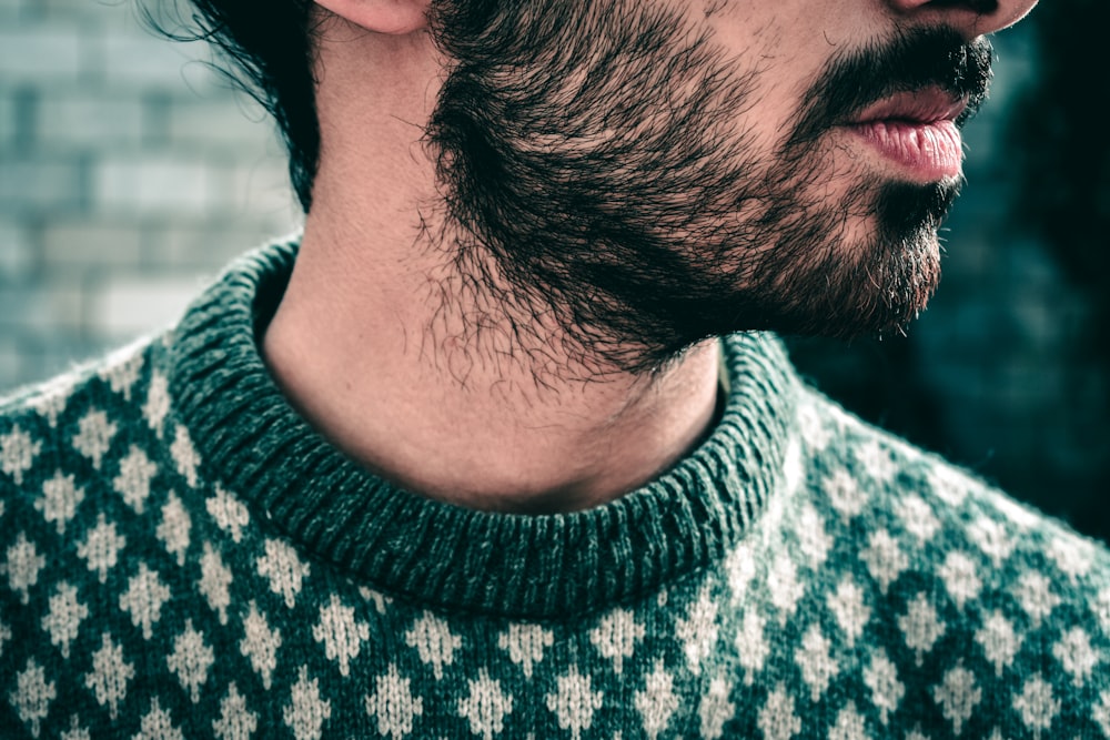 man wearing black and white knit sweater during daytime