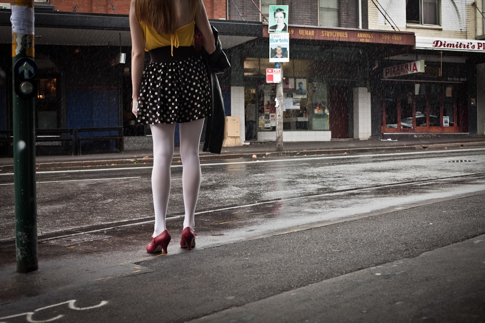 woman standing near road during daytime