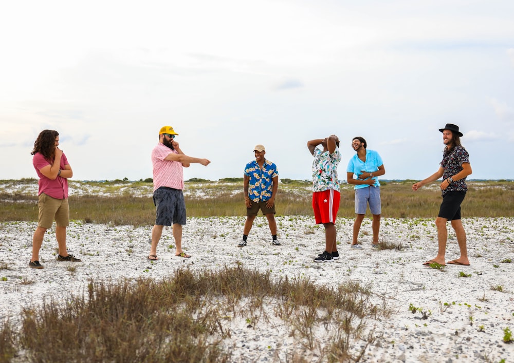 six people on grass field