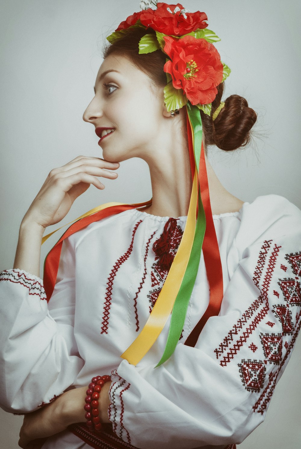 woman smiling near wall