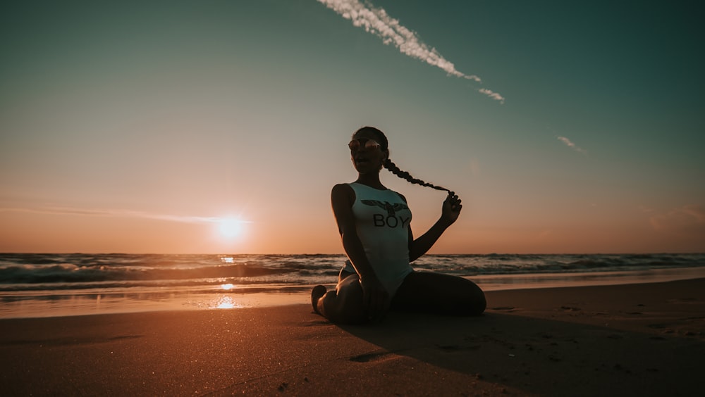 woman sitting on seashore