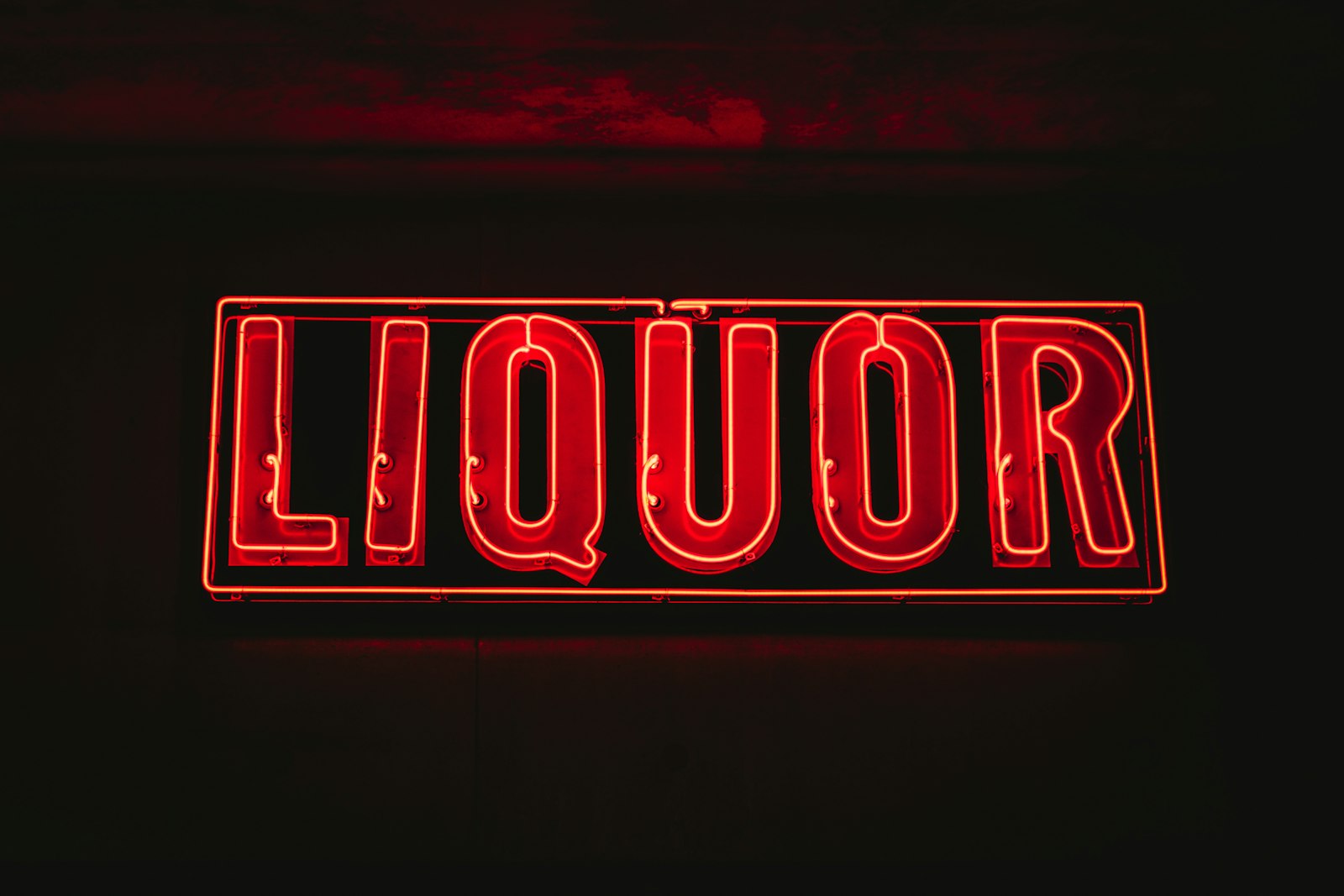 Olympus M.Zuiko Digital ED 30mm F3.5 Macro sample photo. Red liquor neon signage photography