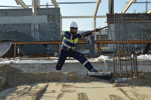 man standing near rods