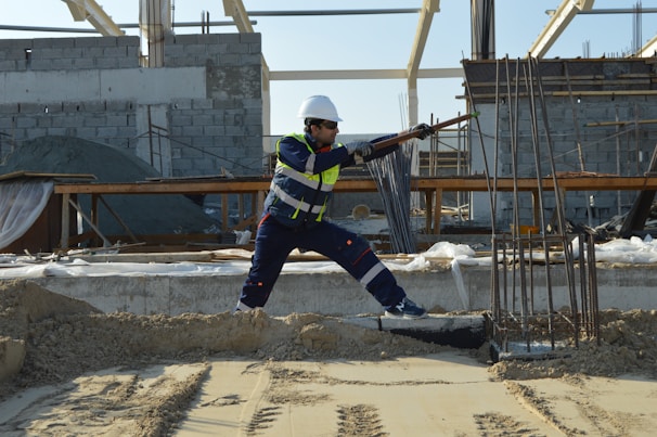 man standing near rods