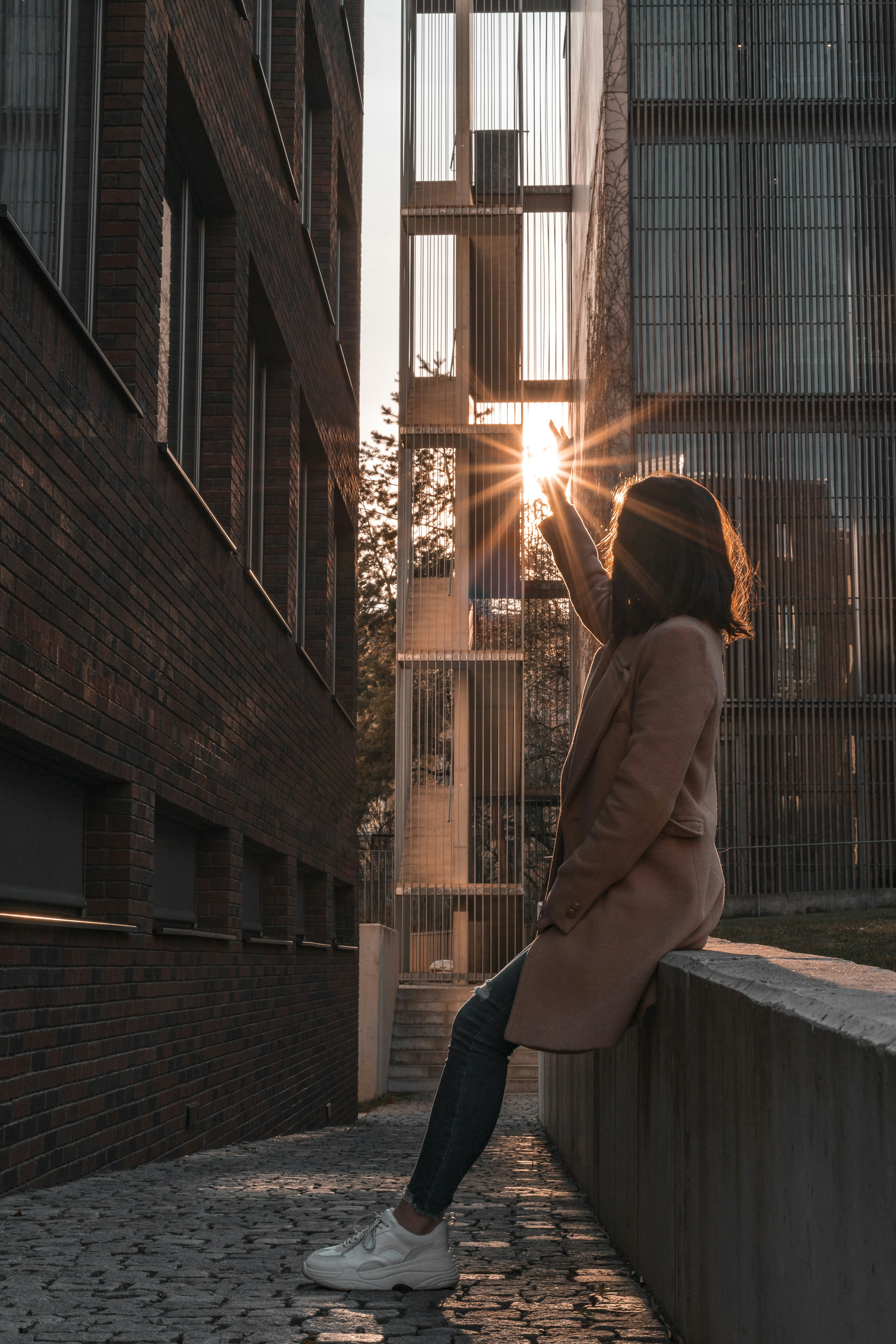 woman sitting on railing