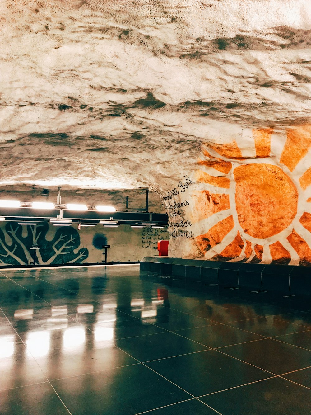 a picture of a sun on a wall in a building
